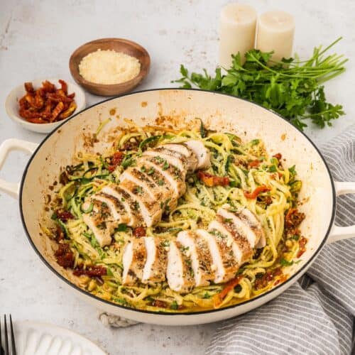 Chicken Zucchini Pasta with sliced chicken in pan.