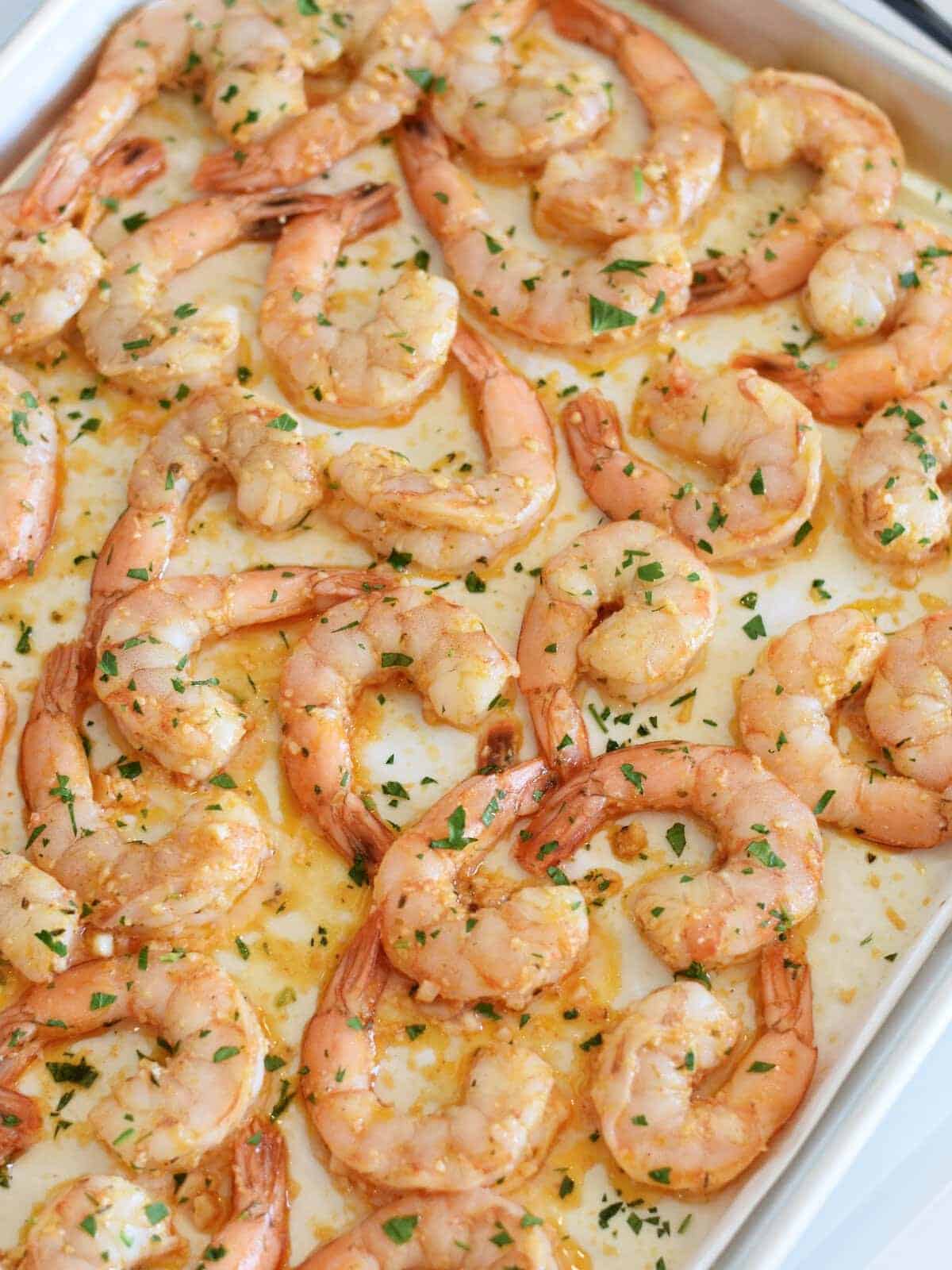 Baked shrimp garnished with chopped herbs-perfect for healthy seafood recipes.