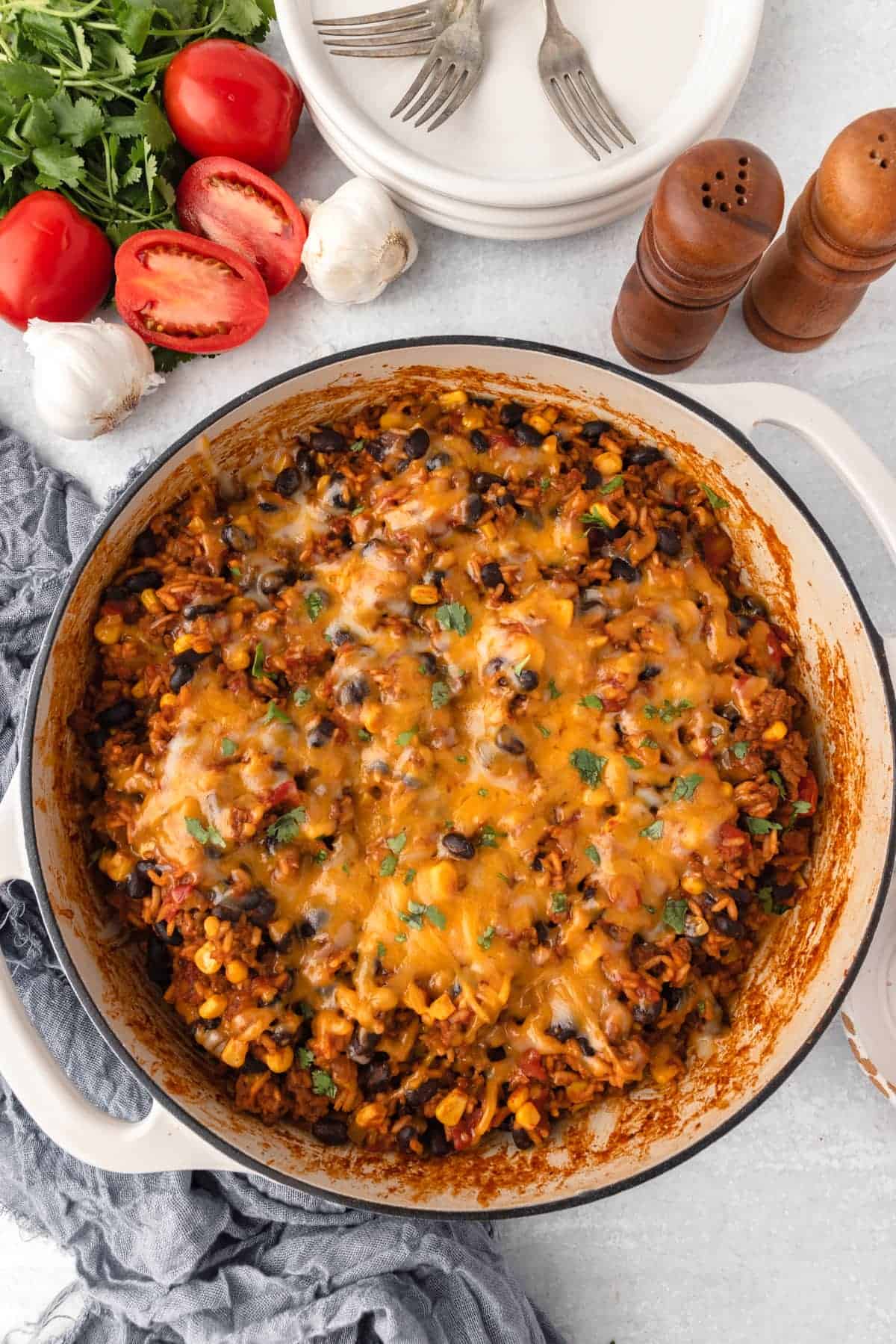 Cheesy baked rice with black beans, corn, and veggies-a winner for ground beef recipes lovers.