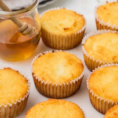 coconut flour muffins served with jar of honey
