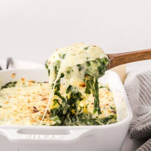 healthy creamed spinach scooped out of dish