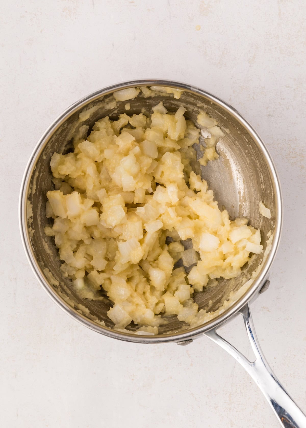 Saucepan with a roux of flour, butter, and onions.