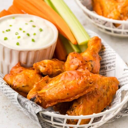 baked buffalo chicken wings served with carrots and celery and blue cheese