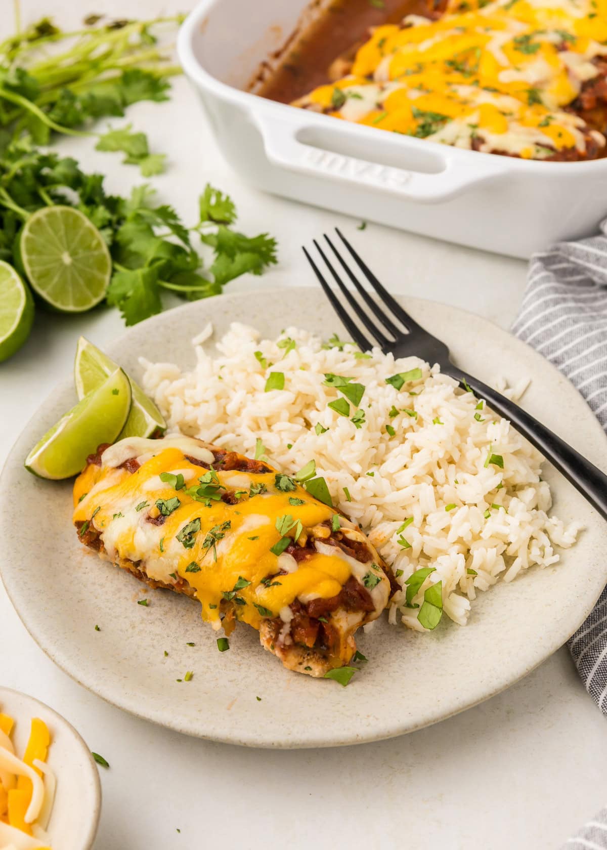 Fiesta Lime Chicken smothered in cheese, served with rice and lime.