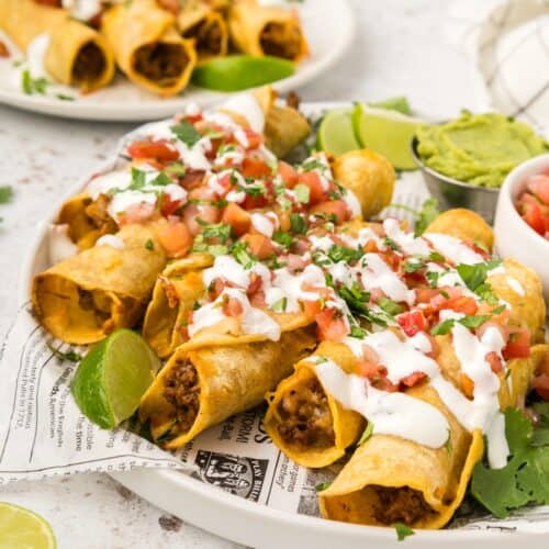 Beef Taquitos served with pico de gallo and guacamole.