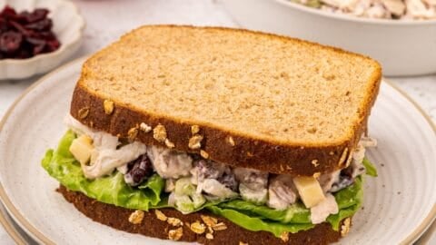 Leftover Turkey Salad on a sandwich, with a bowl of it in the background.