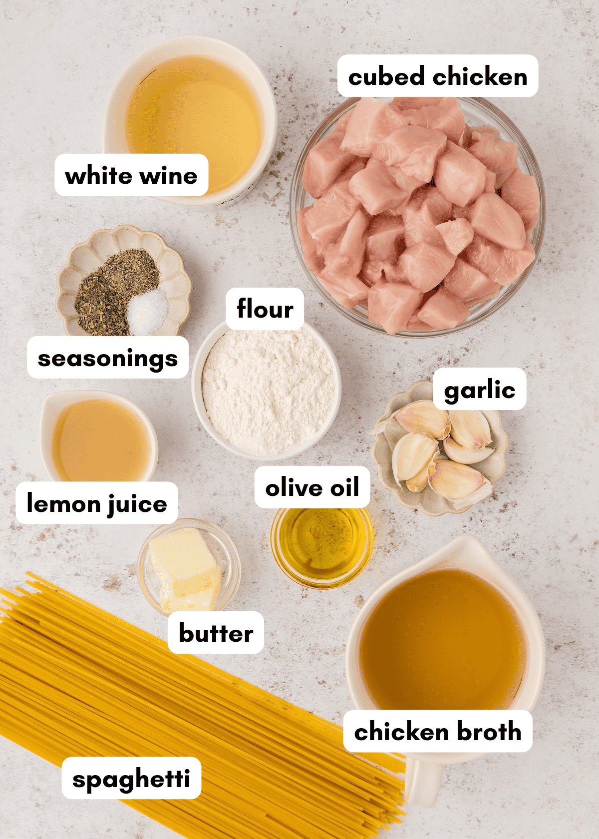 Labeled chicken scampi ingredients, including spaghetti, broth, and flavorful seasonings.