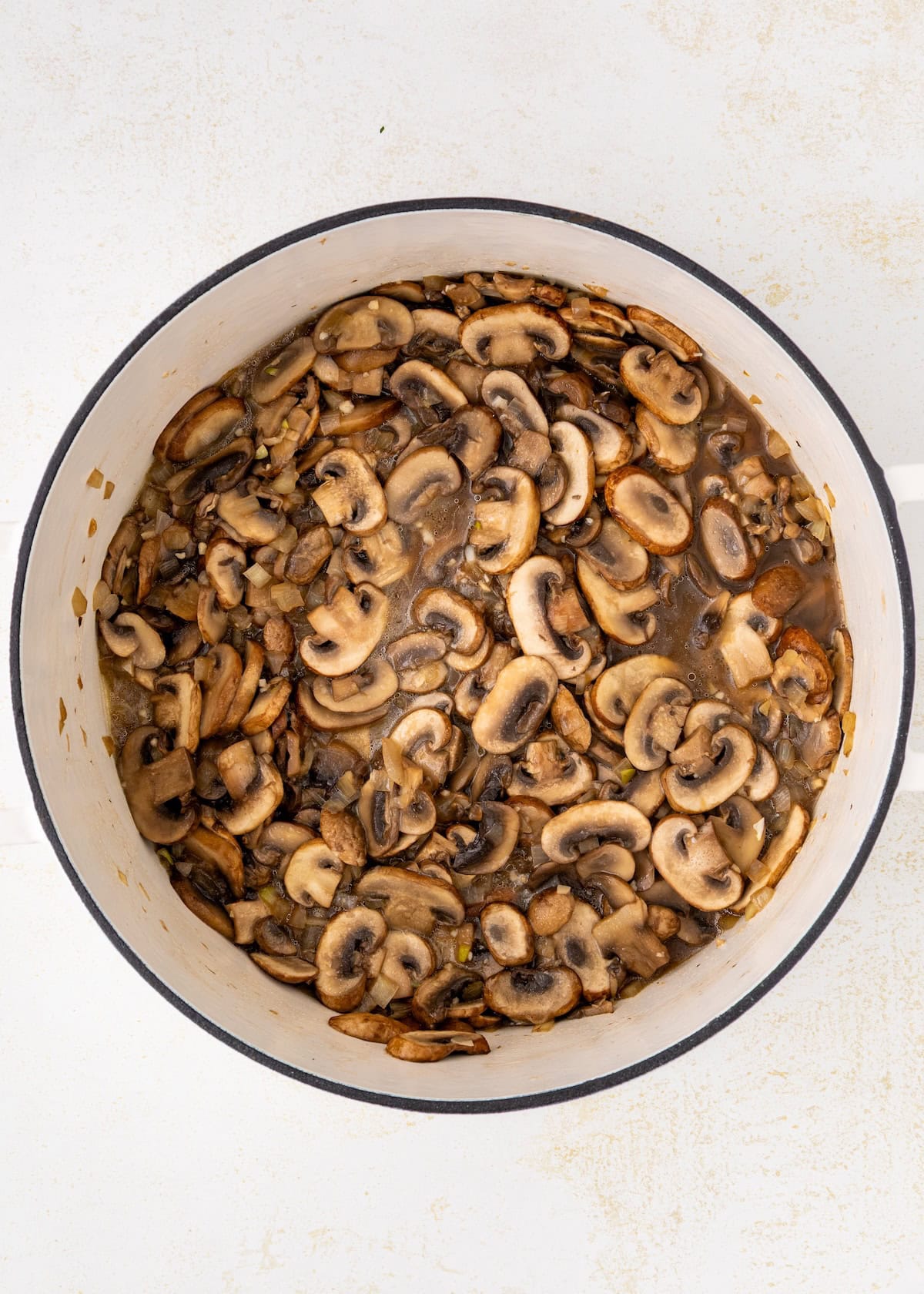 A pot of mushrooms in a white bowl.