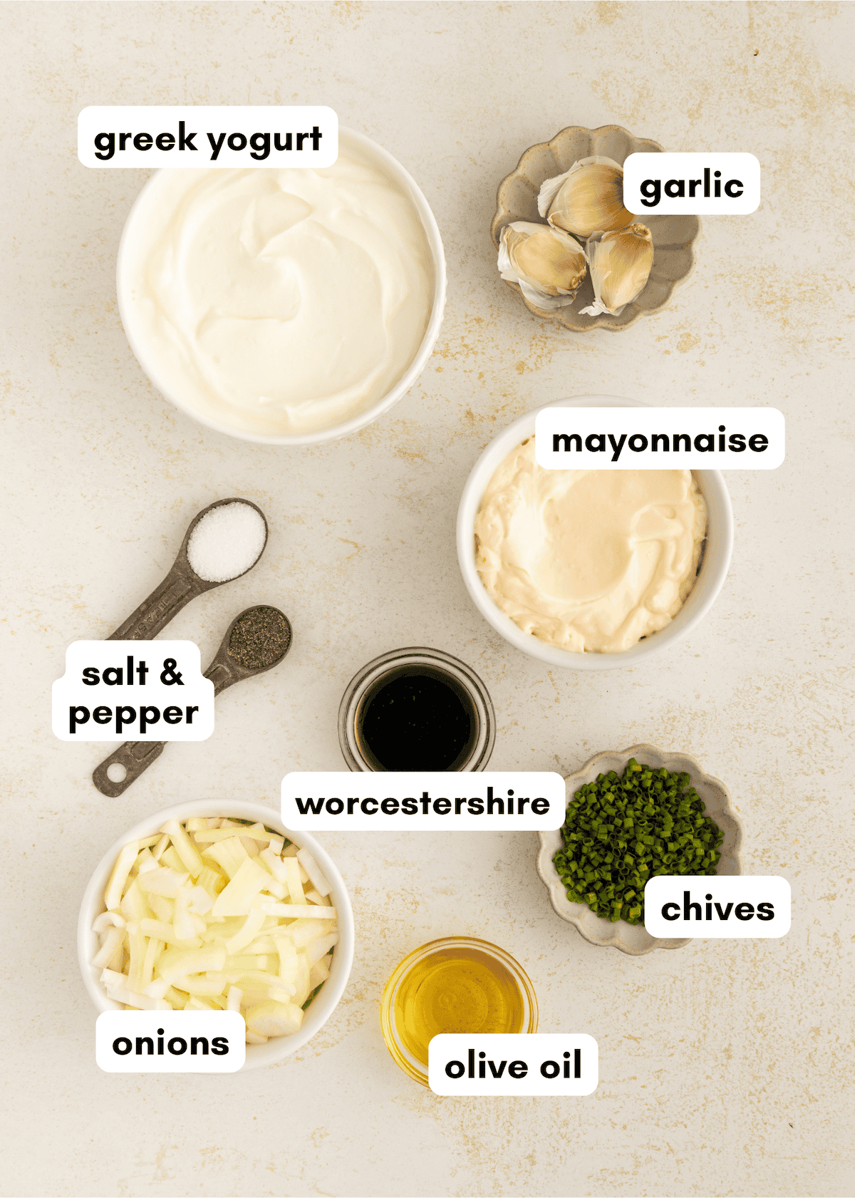 Ingredients for a dip: yogurt, mayonnaise, onions, chives, garlic, oil, Worcestershire, salt, pepper.