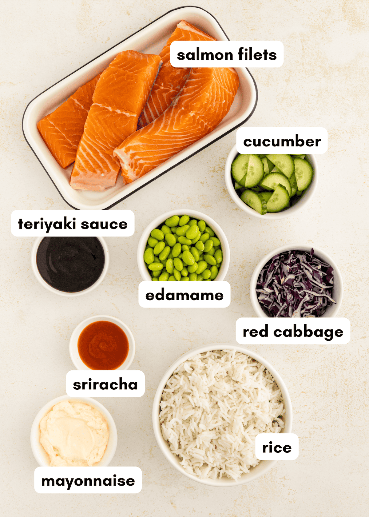 Salmon filets, cucumber, edamame, red cabbage, rice, teriyaki sauce, mayo, and sriracha.