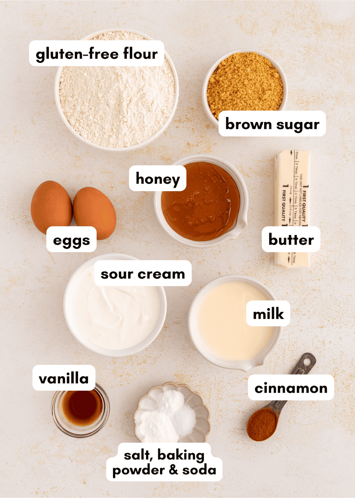 Gluten-free coffee cake ingredients: flour, sugar, honey, butter, eggs, sour cream, vanilla, spices.