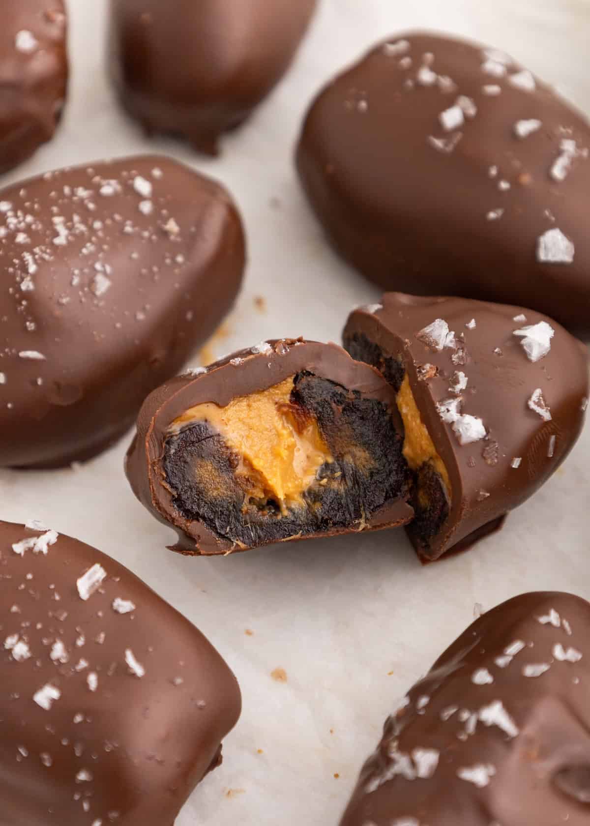 Chocolate-covered dates filled with peanut butter, sprinkled with sea salt.