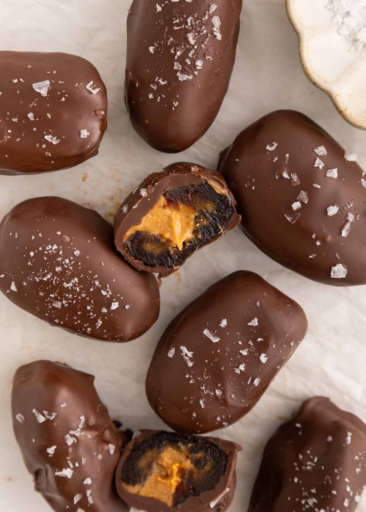 Chocolate-covered dates stuffed with peanut butter and sprinkled with sea salt.