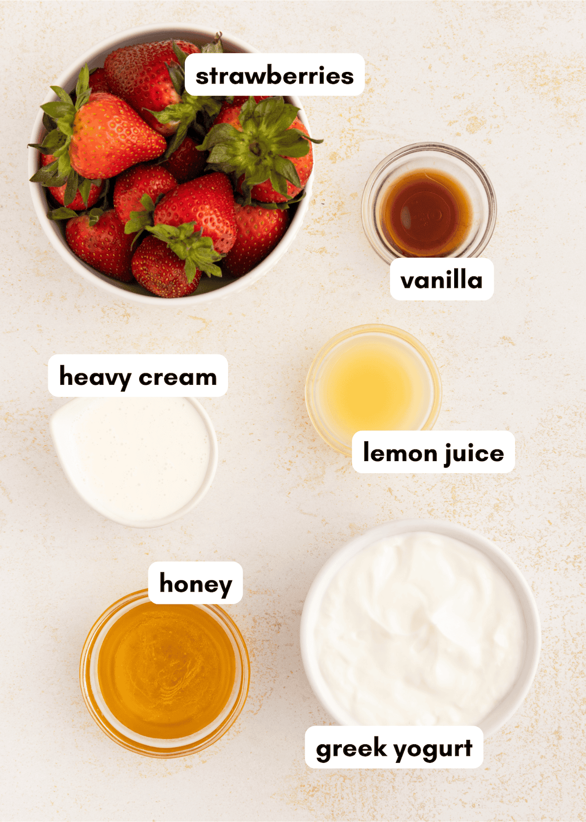 Fresh strawberries, honey, cream, and yogurt-perfect for homemade strawberry cream popsicles.