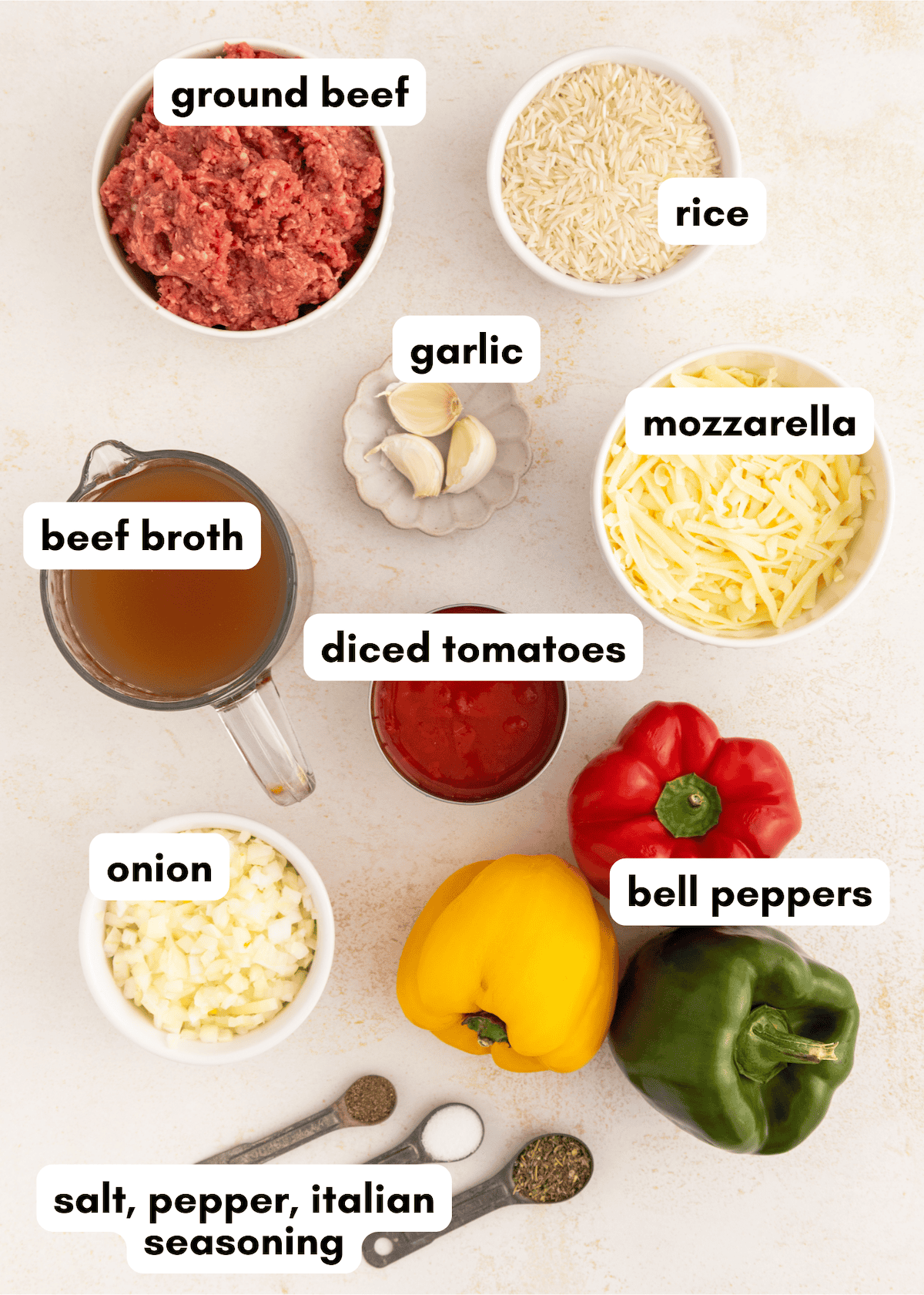 Ingredients for stuffed peppers, including ground beef, rice, cheese, peppers, and seasonings.